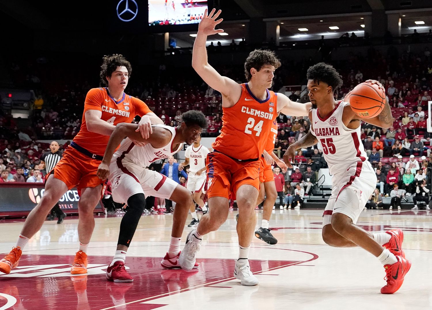 Clemson Tigers center PJ Hall (24) defends Alabama guard Aaron Estrada (55) at Coleman Coliseum.